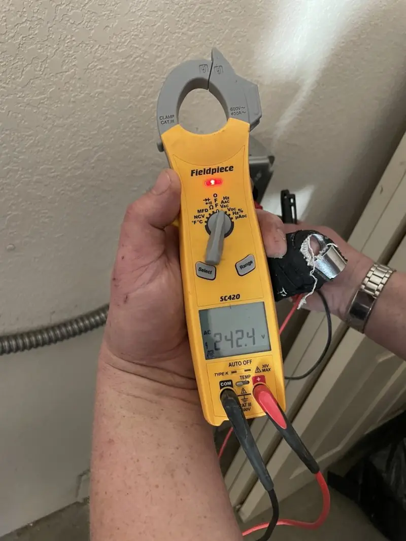 Voltage testing with clamp meter during Generator Installation in Berthoud